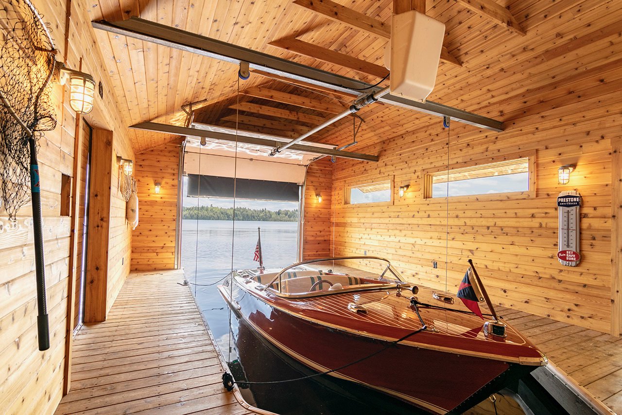 cedar-clad-boathouse-home-to-an-elitecraft-riviera-adirondack-camp-on-upper-saranac-lake